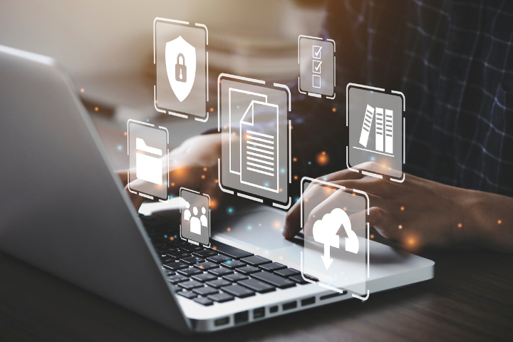 person using laptop with transparent icons overlaid
